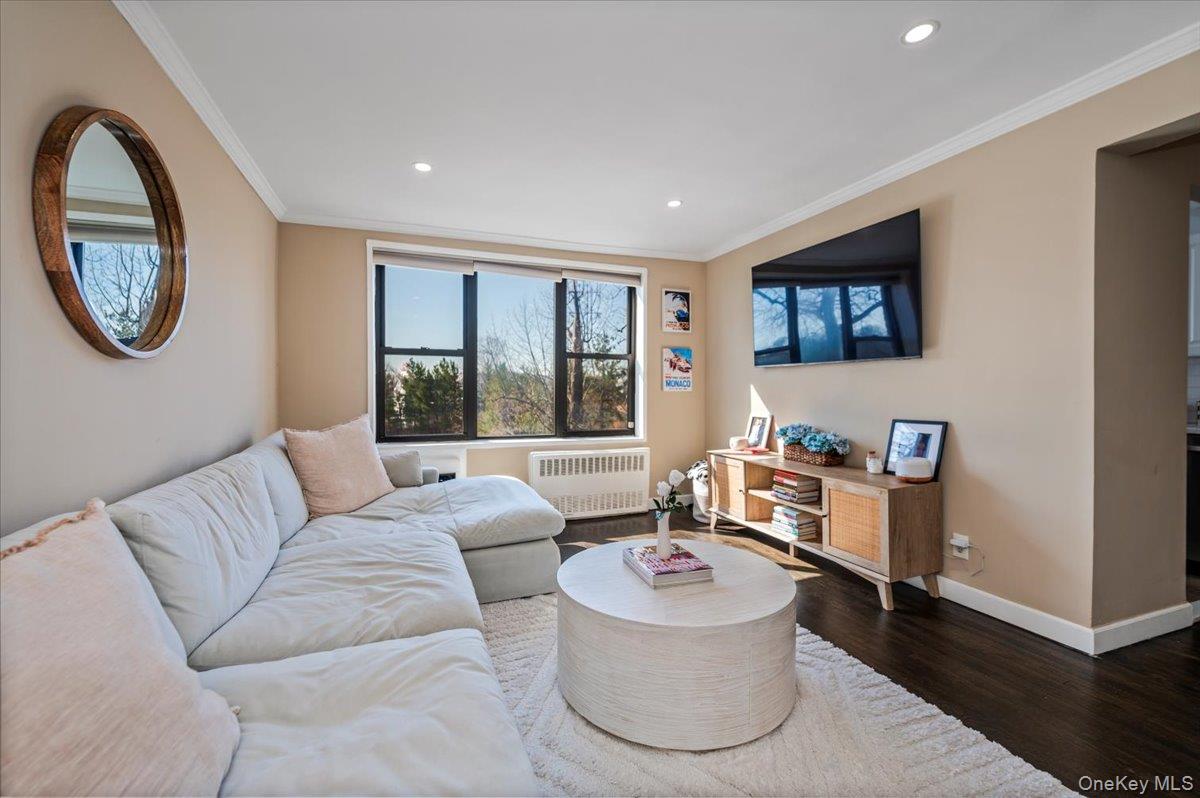 1 Remsen Road, Unit 4J Yonkers, NY 10710 - Photo 3 of 15 a living room with furniture and a large window