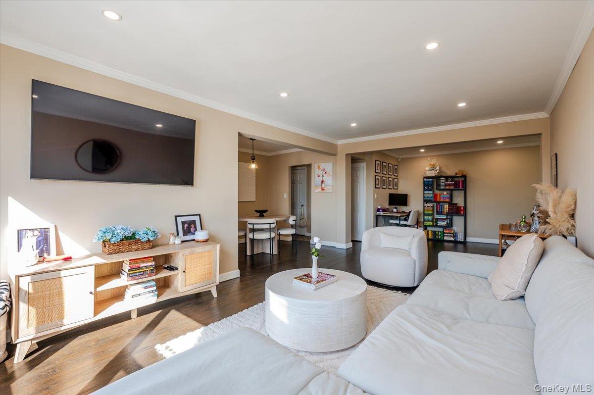 1 Remsen Road, Unit 4J Yonkers, NY 10710 - Photo 4 of 15 a living room with furniture and a flat screen tv