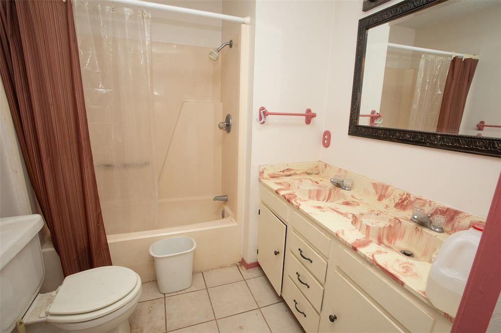 0 Pecan Lane Newcastle, TX 76372 - Photo 18 of 29 a bathroom with a sink a toilet a mirror and shower