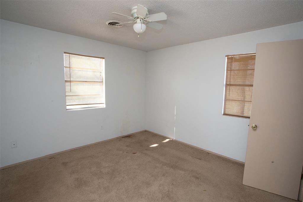 0 Pecan Lane Newcastle, TX 76372 - Photo 19 of 29 an empty room with windows and fan
