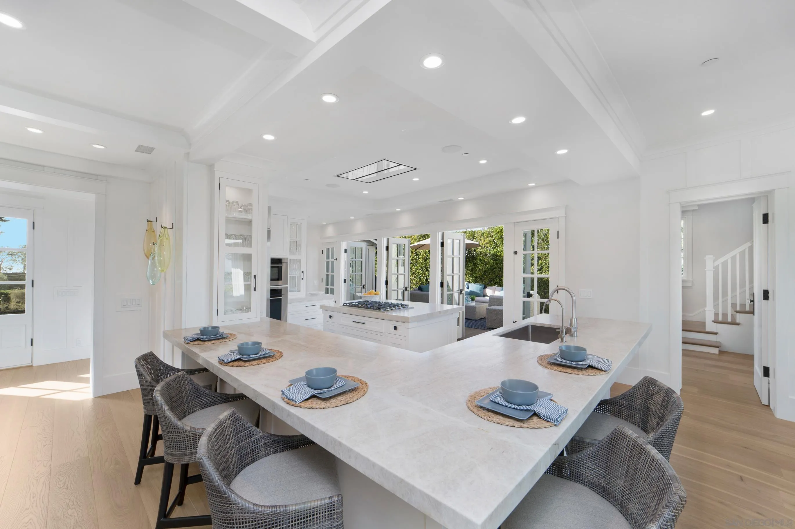 1145 Crest Road Del Mar, CA 92014 - Photo 11 of 57 a view of a dining room with furniture and wooden floor