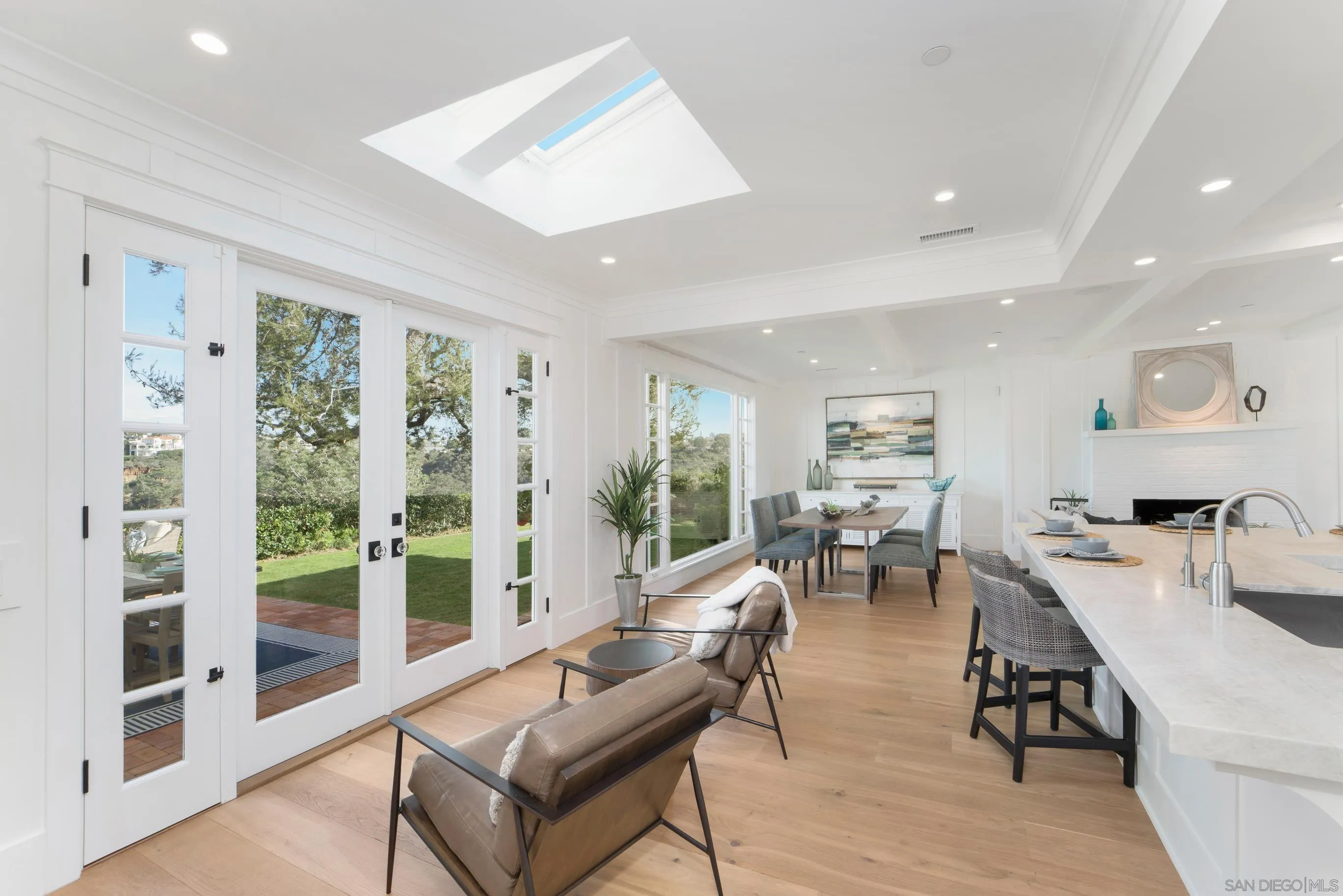 1145 Crest Road Del Mar, CA 92014 - Photo 19 of 57 a living room with furniture large window and wooden floor
