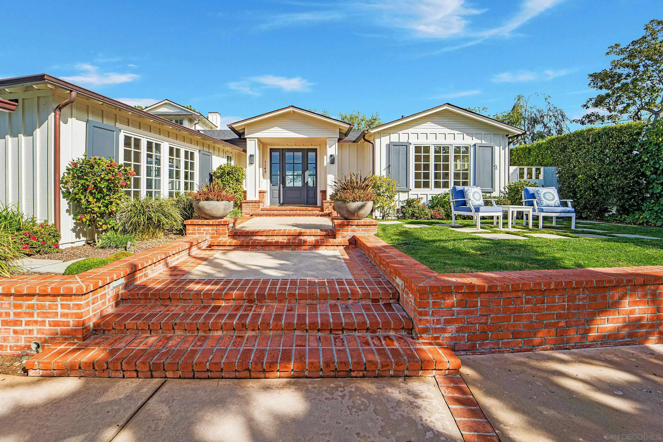 1145 Crest Road Del Mar, CA 92014 - Photo 2 of 57 a front view of a house with yard and green space