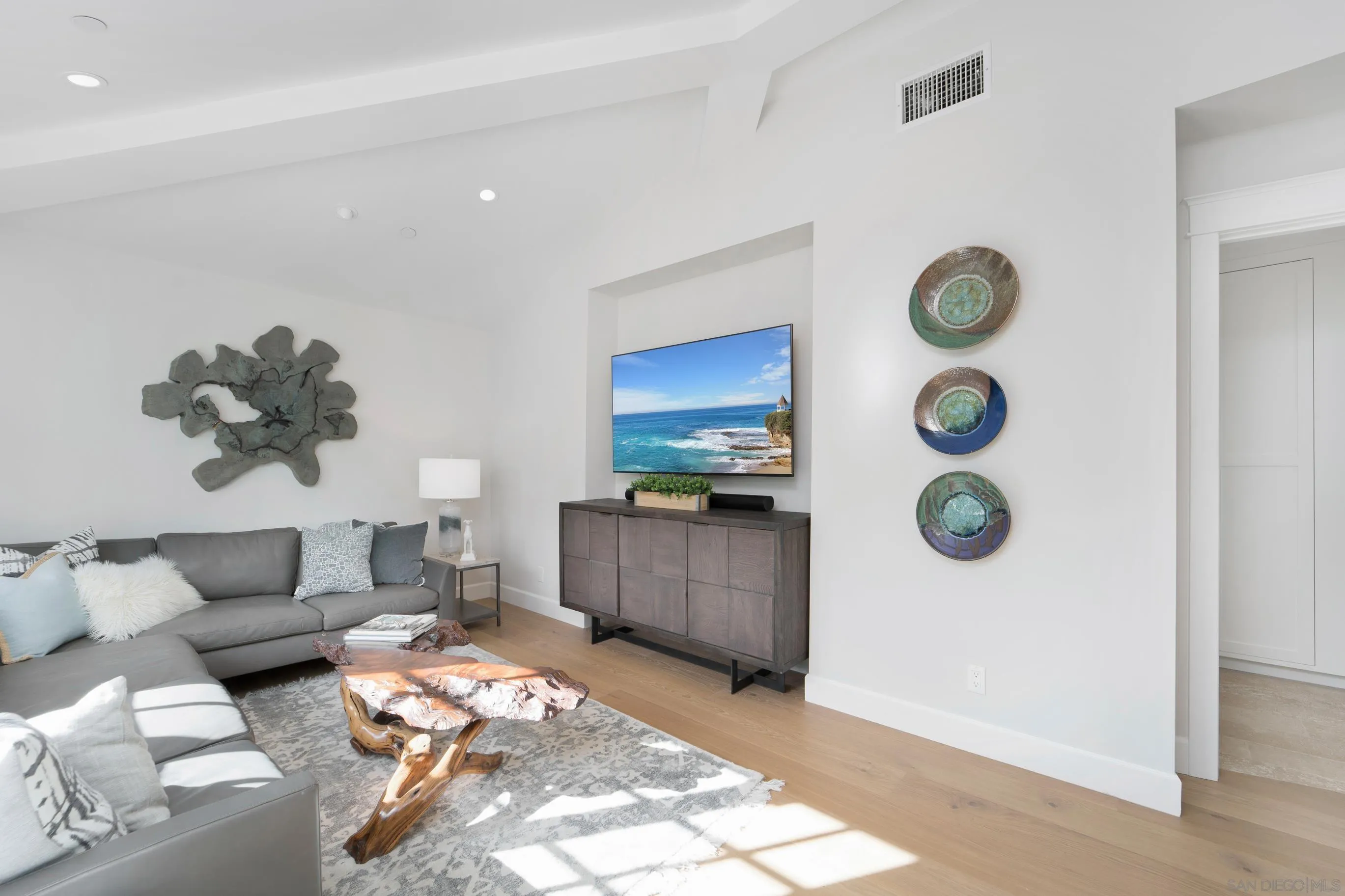 1145 Crest Road Del Mar, CA 92014 - Photo 23 of 57 a living room with couches and a flat screen tv
