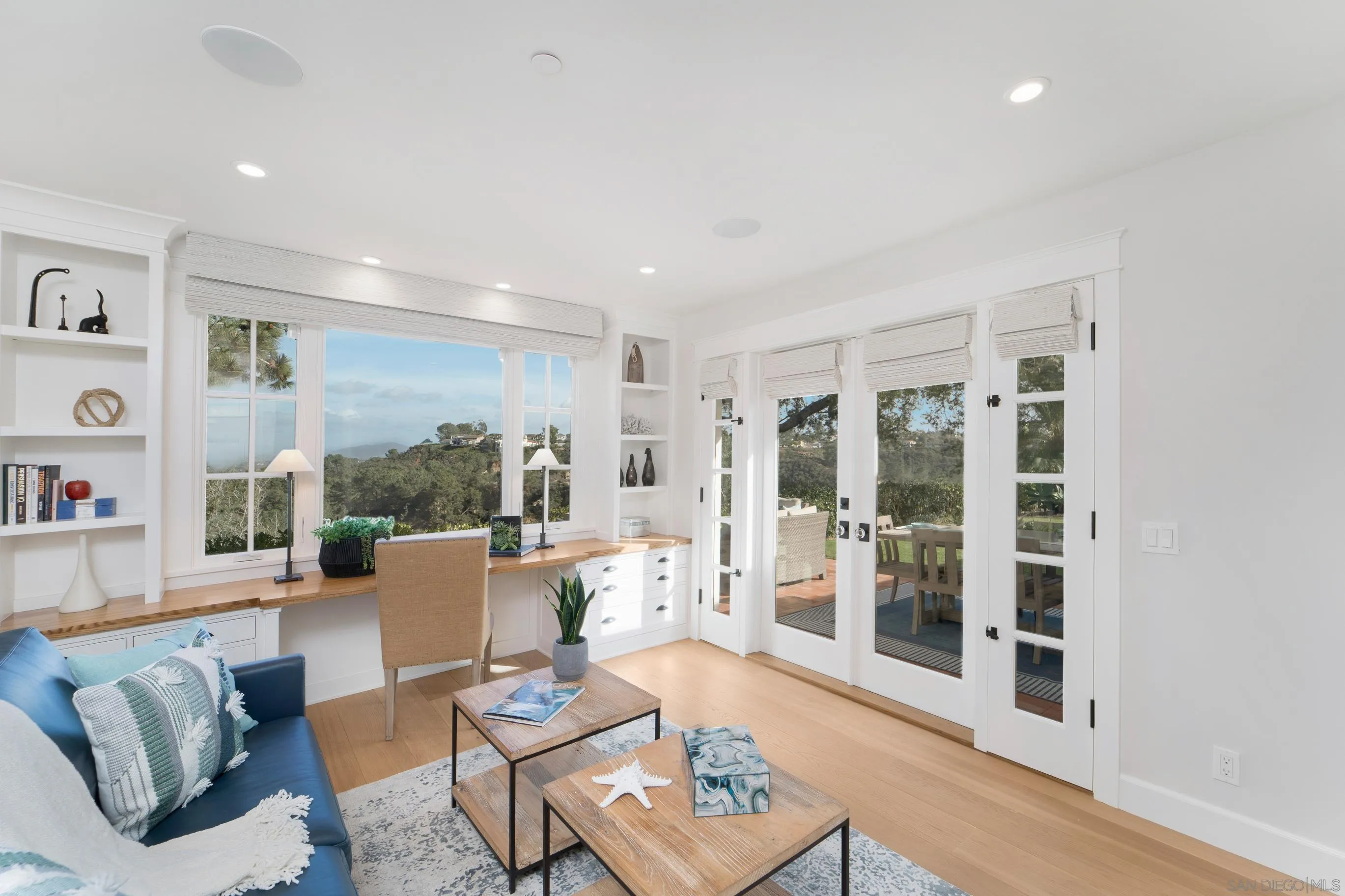 1145 Crest Road Del Mar, CA 92014 - Photo 25 of 57 a living room with furniture and a floor to ceiling window