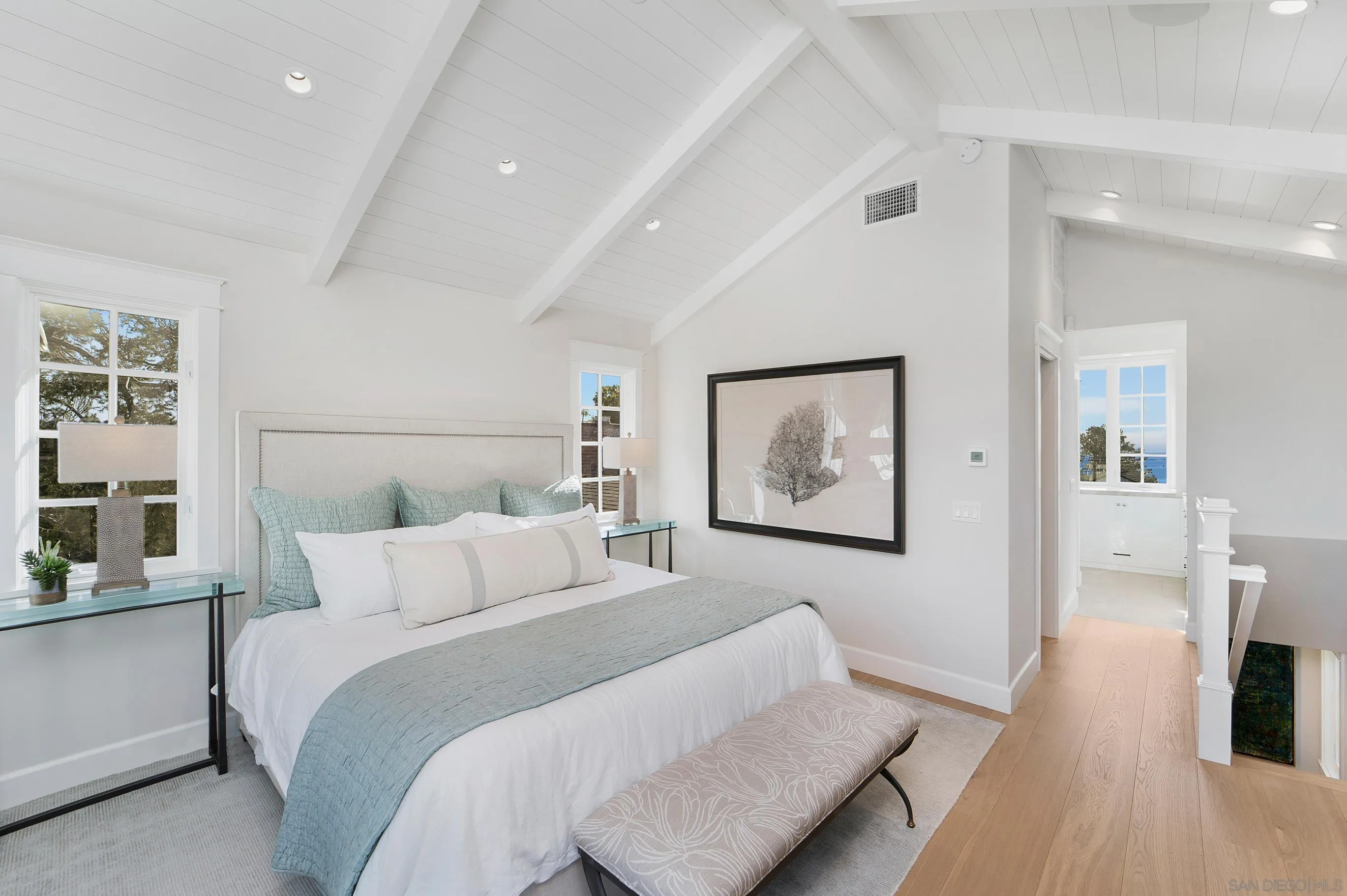 1145 Crest Road Del Mar, CA 92014 - Photo 30 of 57 a bedroom with a bed and a painting on the wall