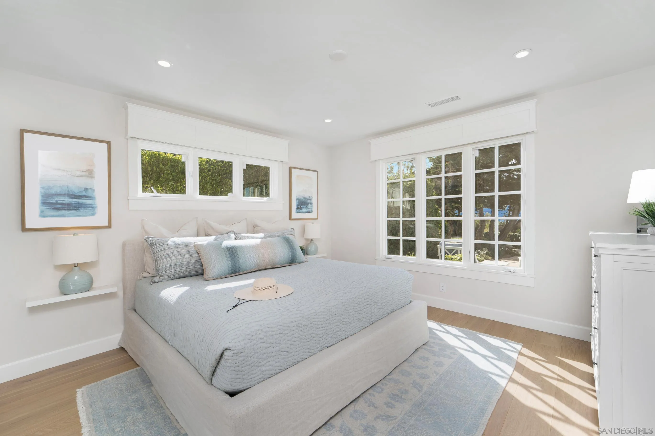 1145 Crest Road Del Mar, CA 92014 - Photo 36 of 57 a bedroom with a bed and a large window