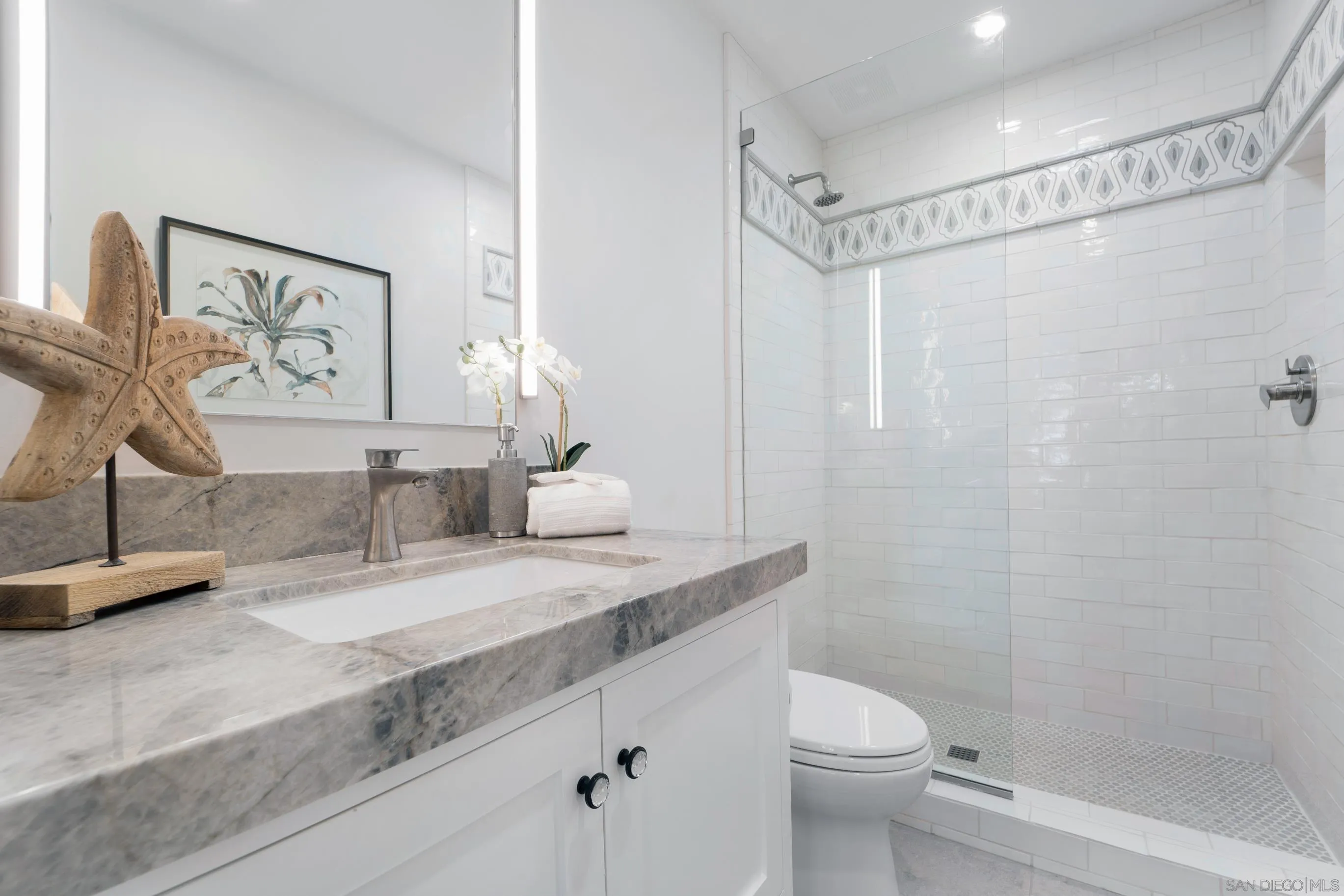 1145 Crest Road Del Mar, CA 92014 - Photo 39 of 57 a bathroom with a granite countertop sink mirror vanity and toilet