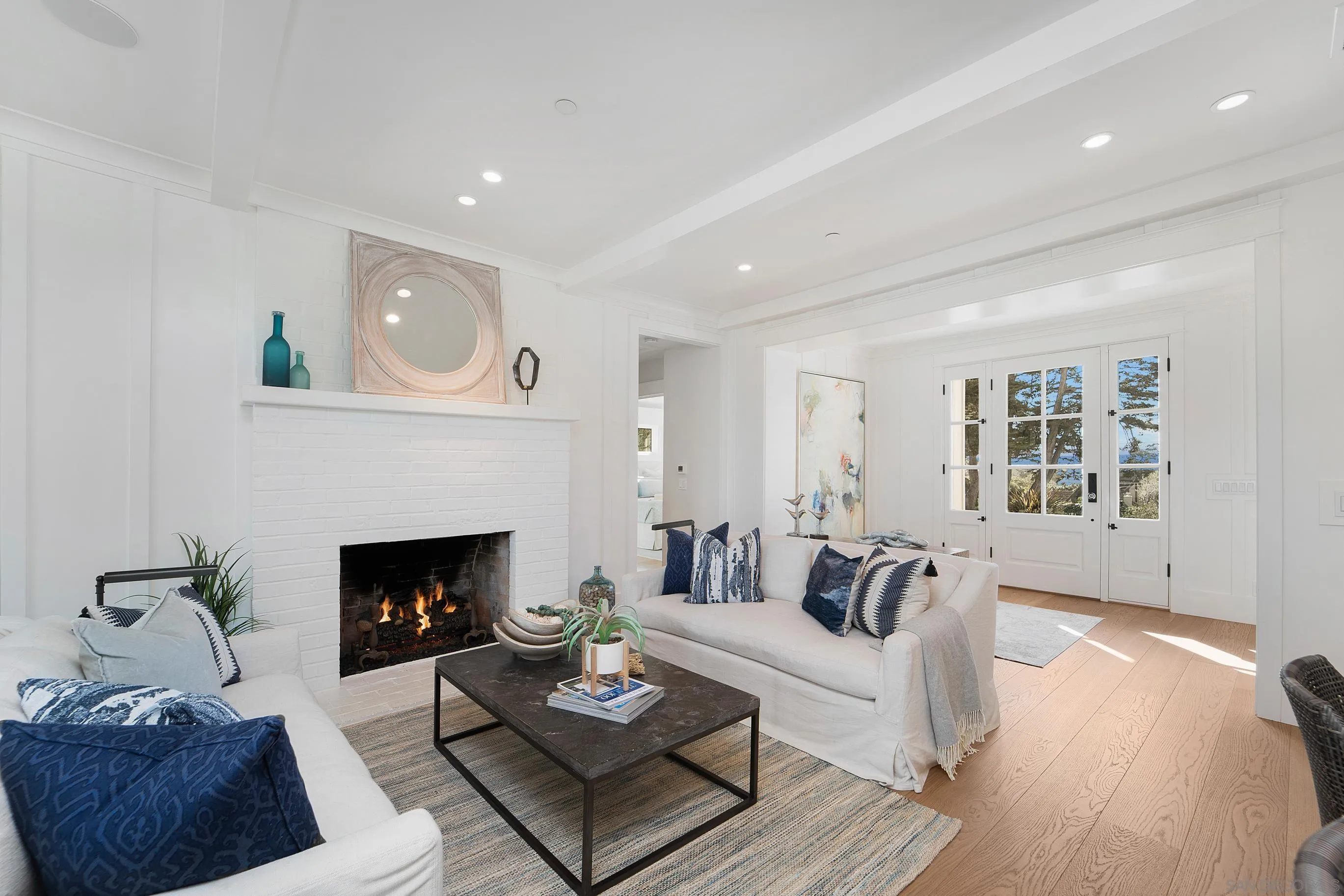 1145 Crest Road Del Mar, CA 92014 - Photo 4 of 57 a living room with furniture and a fireplace