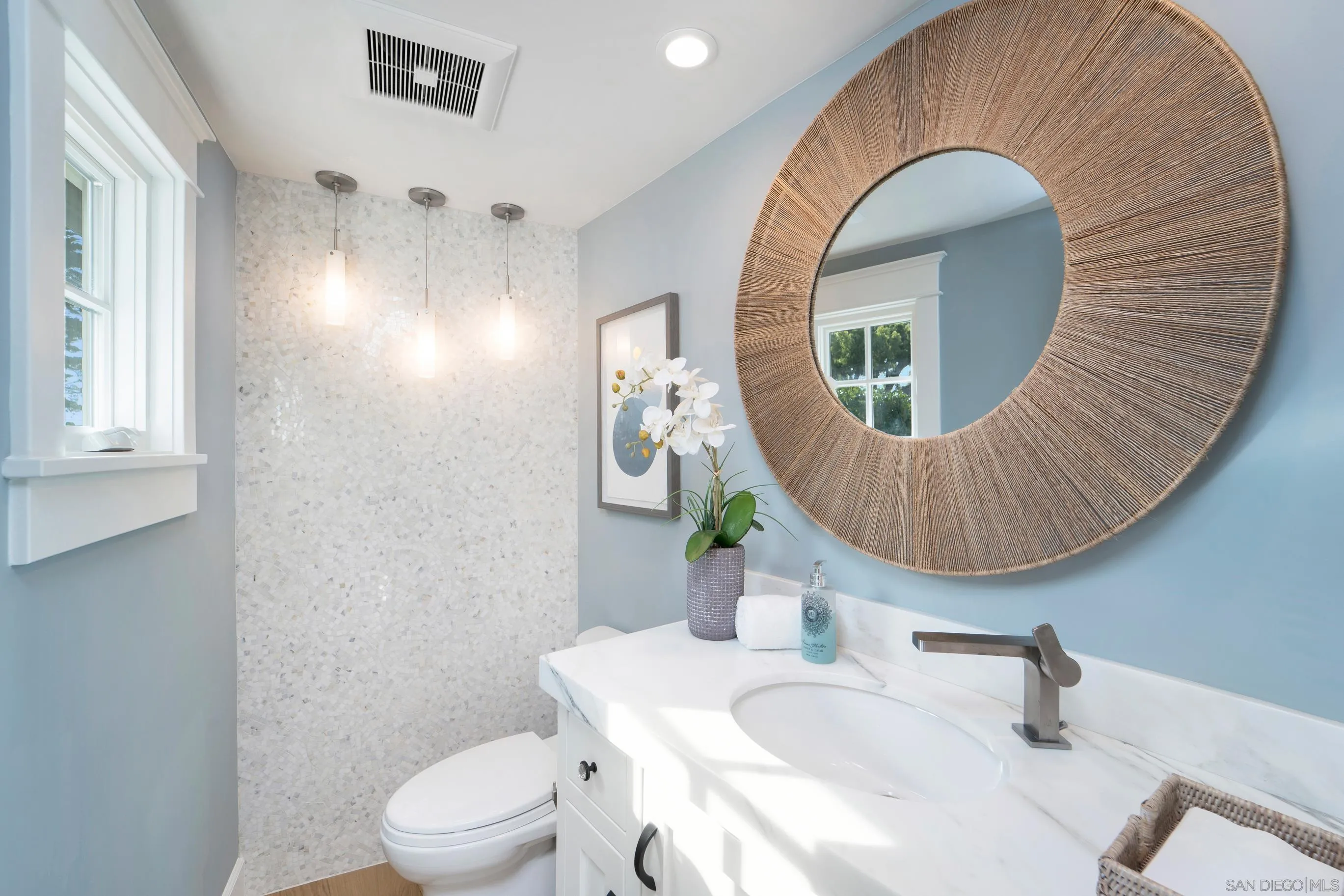 1145 Crest Road Del Mar, CA 92014 - Photo 41 of 57 a bathroom with a toilet sink and mirror