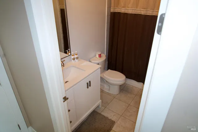 a view of room with wooden floor and a window