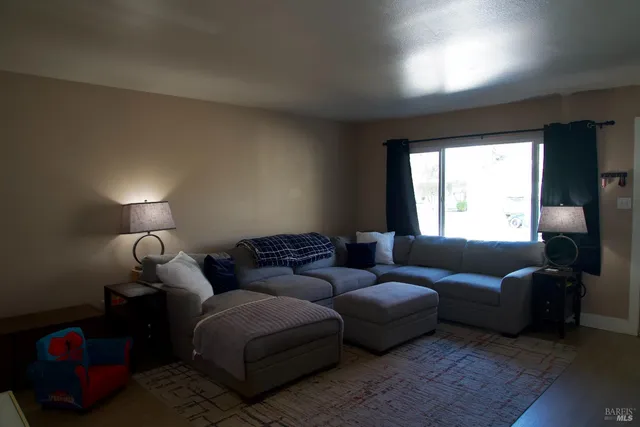a living room with furniture and a window