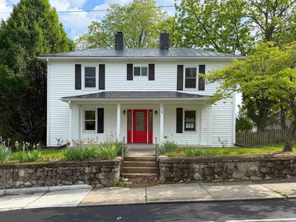 a front view of a house with garage