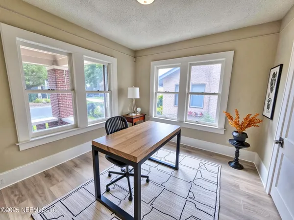 a workspace with furniture and a window