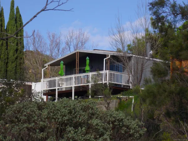 a house with trees in front of it