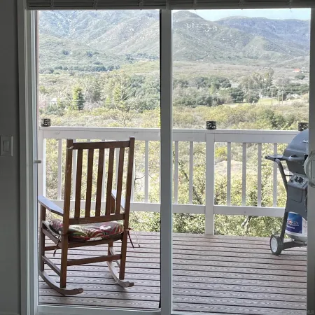 a view of a balcony with chairs