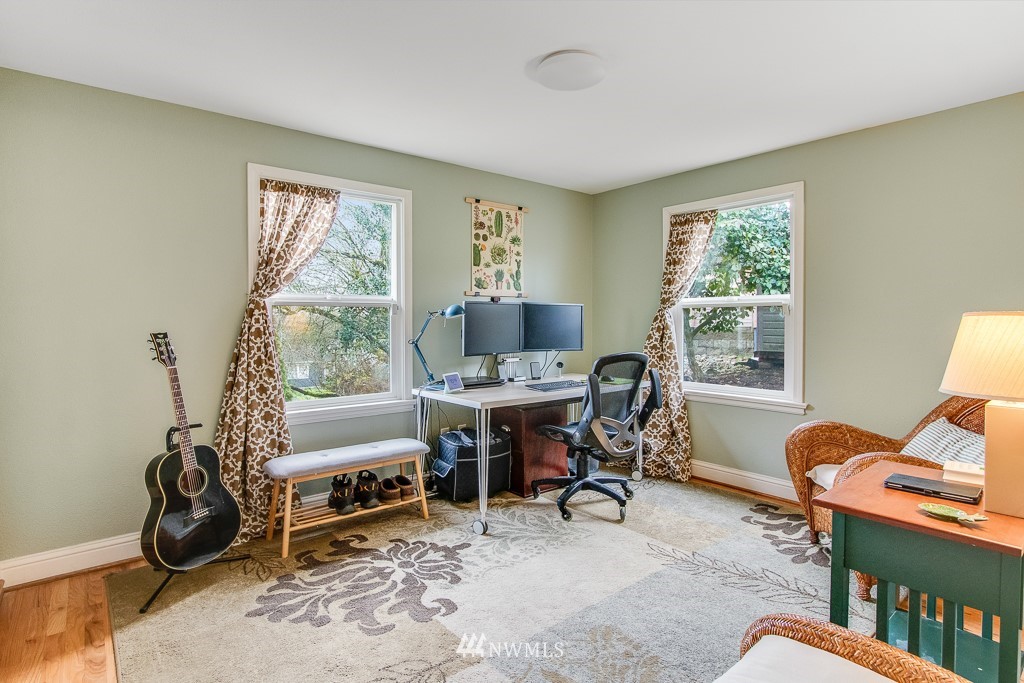 6715 35th Avenue Southwest Seattle, WA 98126 - Photo 13 of 31 a workspace with furniture and a window