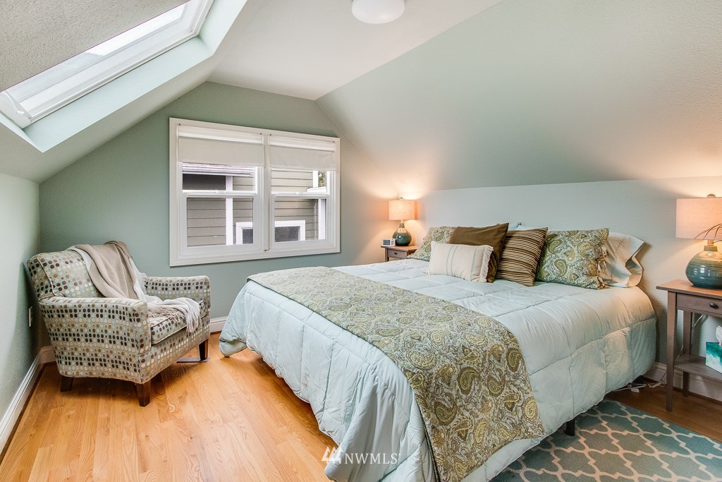 6715 35th Avenue Southwest Seattle, WA 98126 - Photo 15 of 31 a bedroom with bed and window