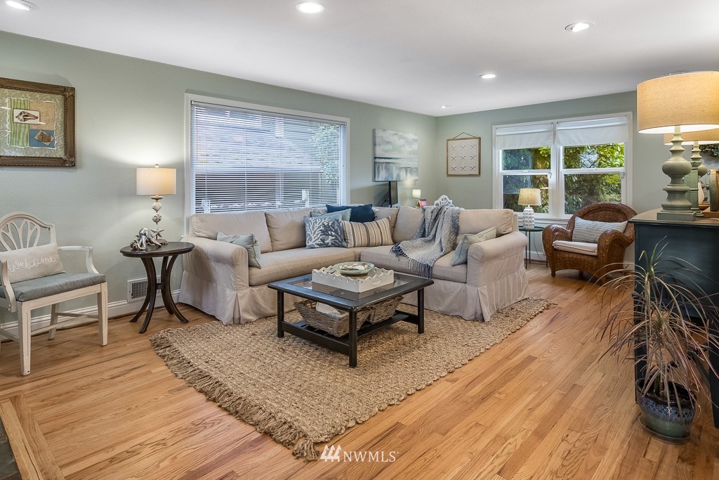 6715 35th Avenue Southwest Seattle, WA 98126 - Photo 2 of 31 a living room with furniture and a large window
