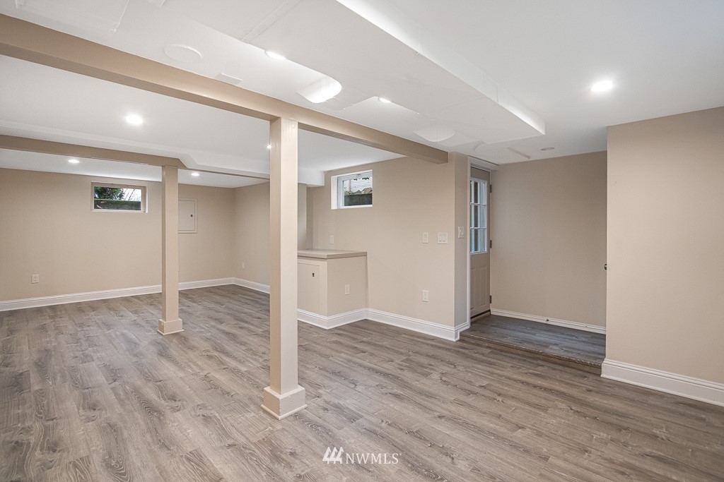 6715 35th Avenue Southwest Seattle, WA 98126 - Photo 21 of 31 a view of empty room with wooden floor