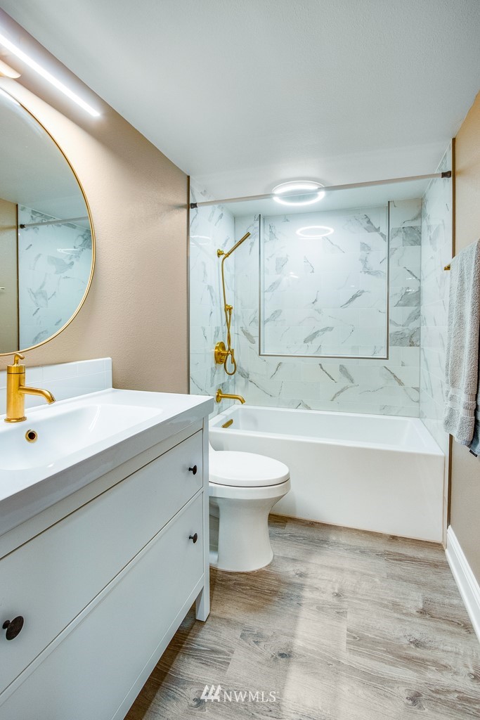6715 35th Avenue Southwest Seattle, WA 98126 - Photo 23 of 31 a bathroom with a toilet a sink and bathtub