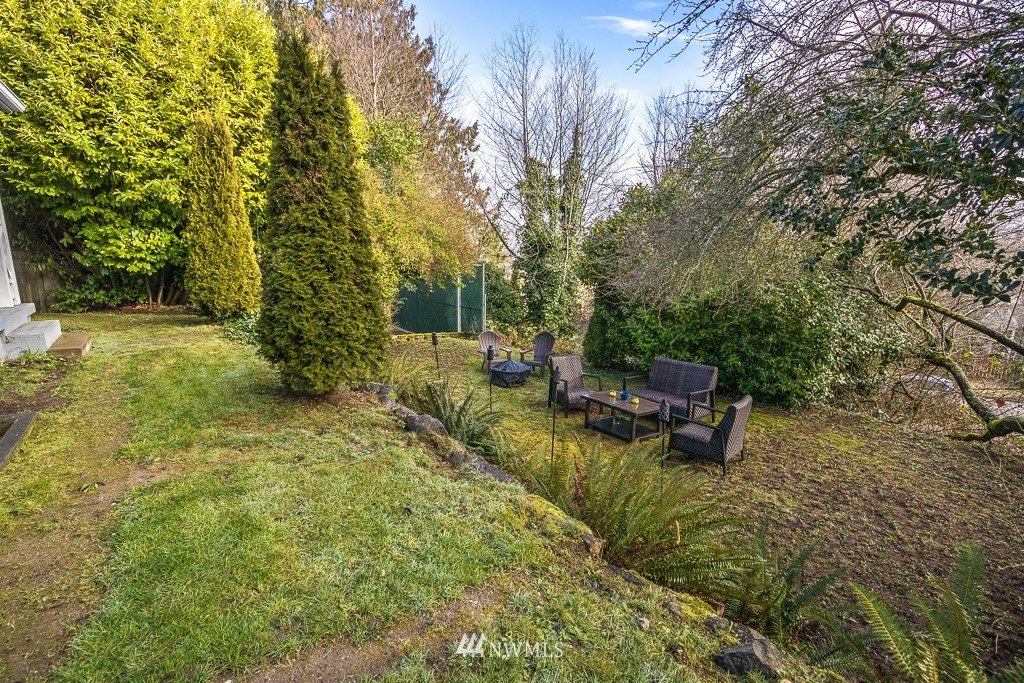 6715 35th Avenue Southwest Seattle, WA 98126 - Photo 29 of 31 a view of swimming pool with chairs and trees