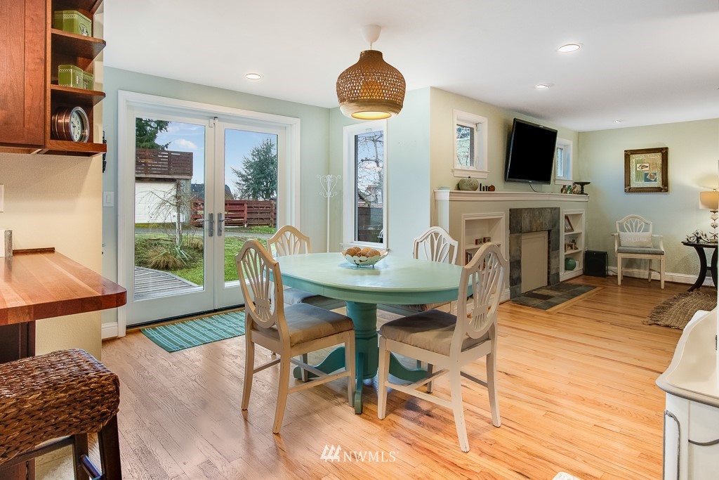 6715 35th Avenue Southwest Seattle, WA 98126 - Photo 6 of 31 a dining room with furniture and wooden floor