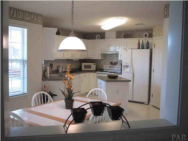 6973 Raburn Road Pensacola, FL 32526 - Photo 1 of 14 Breakfast nook and kitchen