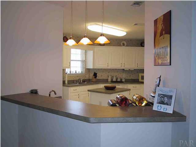 6973 Raburn Road Pensacola, FL 32526 - Photo 8 of 14 Wet bar with bar counter