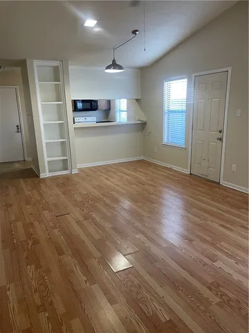 a kitchen with granite countertop stainless steel appliances a stove oven and sink