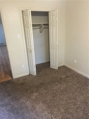 a kitchen with a refrigerator and a window