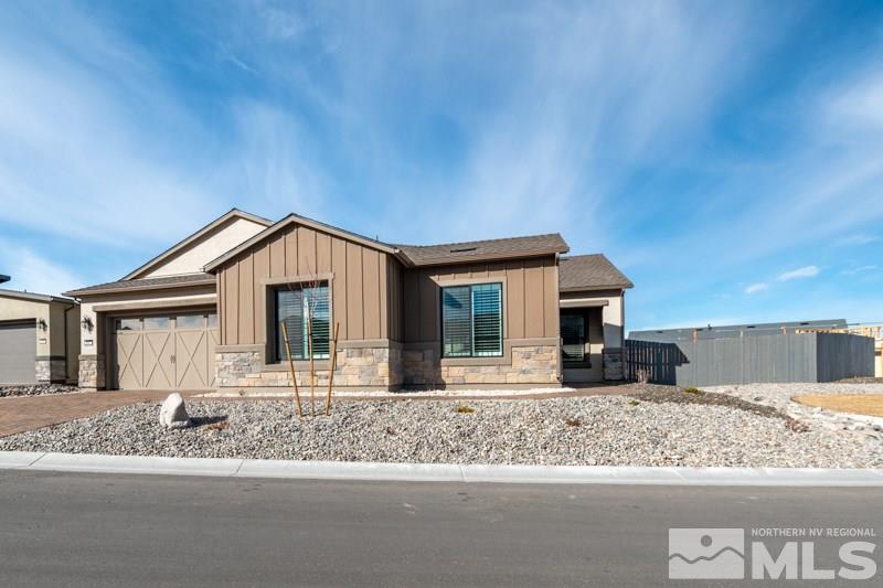 2537 Titanium Crest Drive Reno, NV 89521 - Photo 2 of 26 a front view of a house with a yard