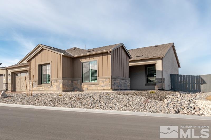 2537 Titanium Crest Drive Reno, NV 89521 - Photo 3 of 26 a front view of house with wooden fence