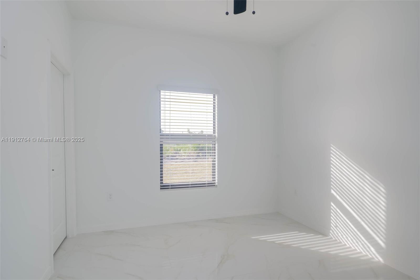 749 Roma Avenue South Lehigh Acres, FL 33974 - Photo 13 of 16 a view of an empty room with a window