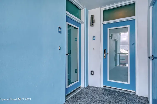 a store room with lots of white furniture and a window