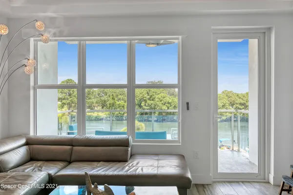 a living room with hardwood floor and furniture