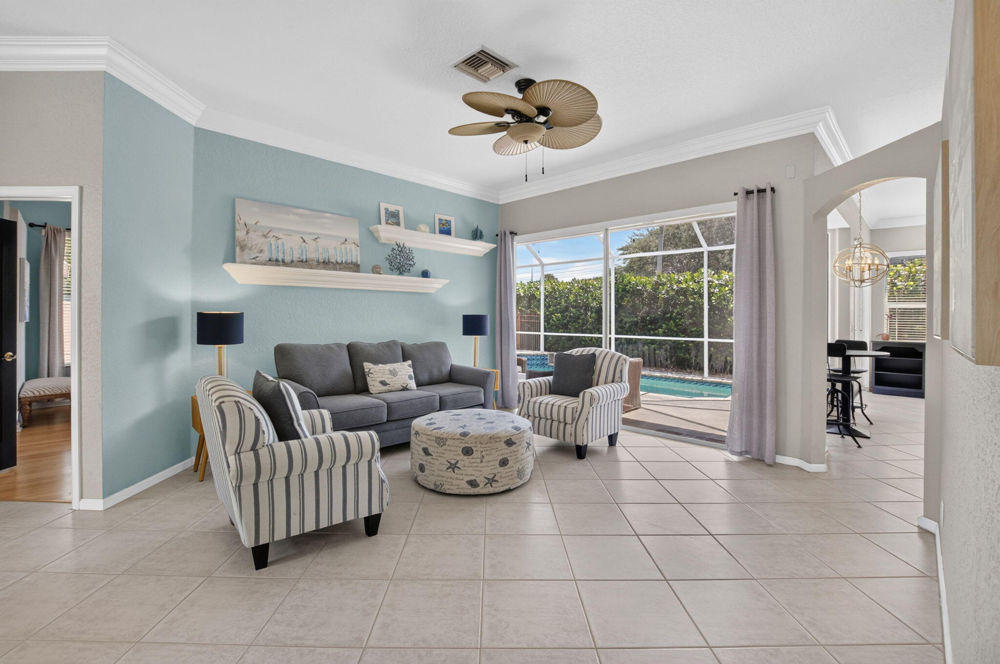 1365 East Barwick Ranch Circle Delray Beach, FL 33445 - Photo 6 of 77 a living room with furniture and a floor to ceiling window