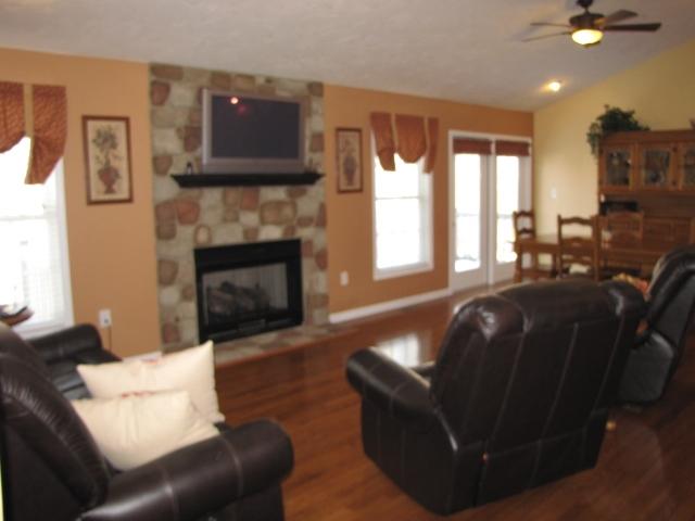 1207 Rabbit Run Road Goodview, VA 24095 - Photo 14 of 36 a living room with furniture and a fireplace