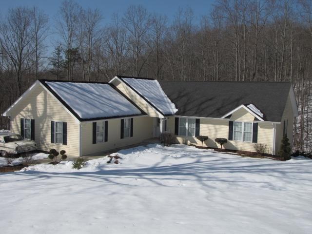 1207 Rabbit Run Road Goodview, VA 24095 - Photo 3 of 36 front view of a house with a yard
