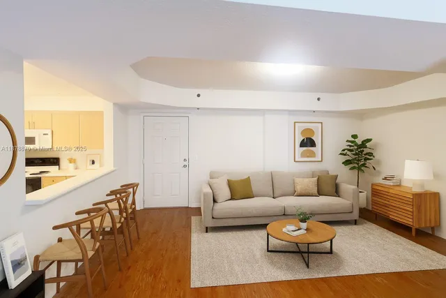 a view of a room with wooden floor and a window