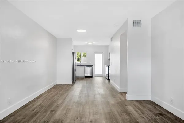 a view of a livingroom with wooden floor