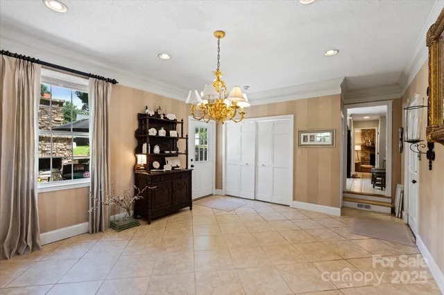 a living room with chandelier