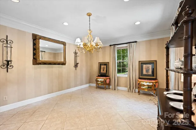 a view of a livingroom with furniture and a chandelier