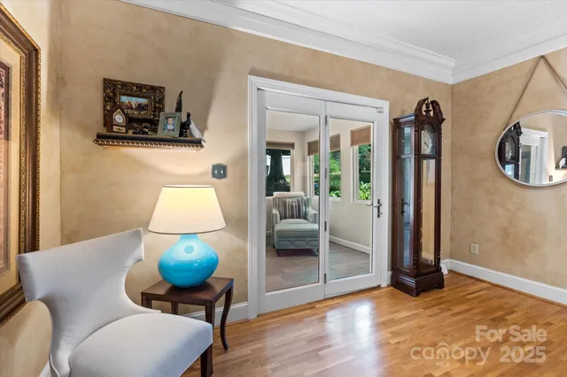 a view of room with furniture and wooden floor