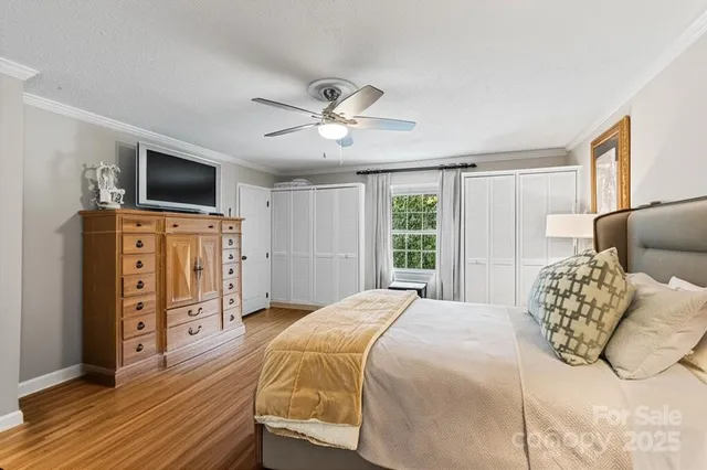 a bedroom with a large bed and a window