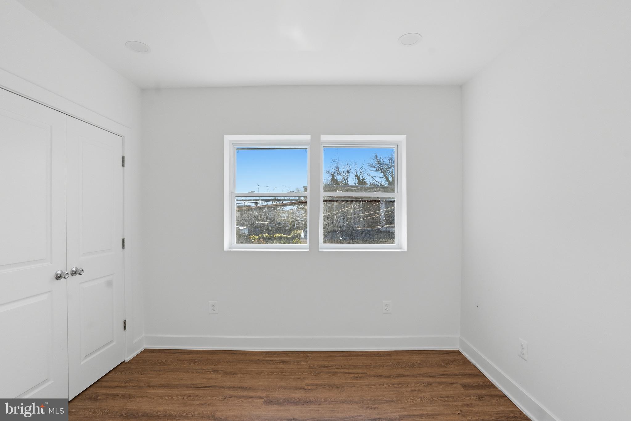 1281 Jackson Street Camden, NJ 08104 - Photo 20 of 43 a view of an empty room with wooden floor and a window