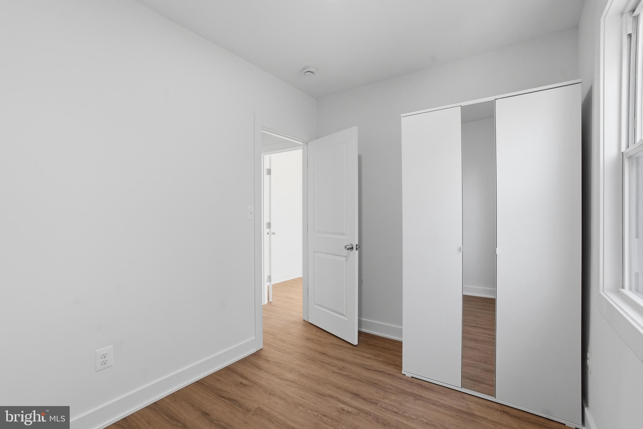 1281 Jackson Street Camden, NJ 08104 - Photo 28 of 43 a view of an empty room with wooden floor