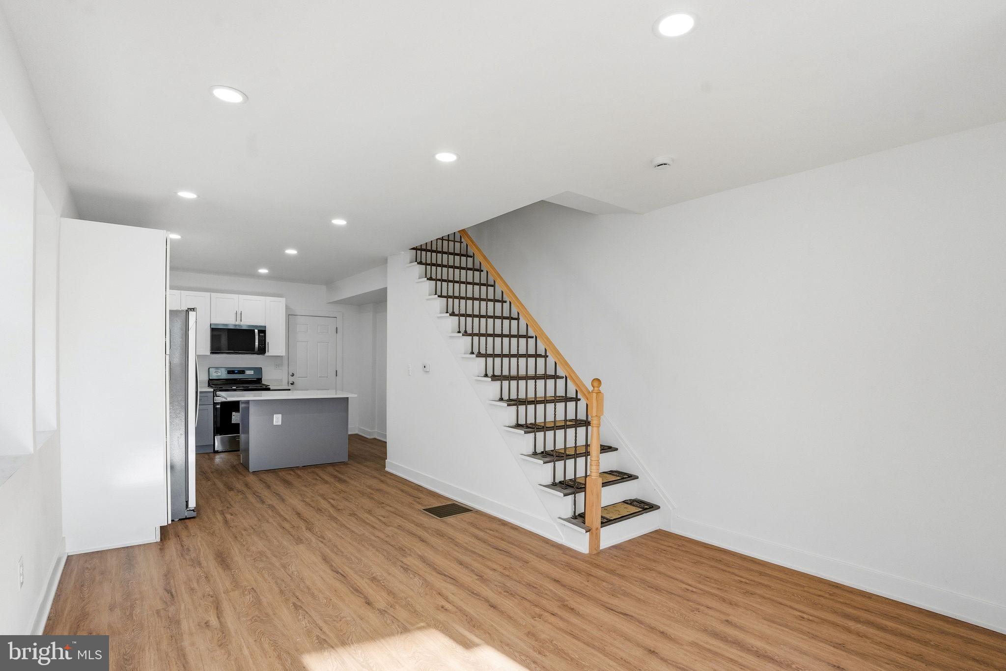 1281 Jackson Street Camden, NJ 08104 - Photo 6 of 43 a view of kitchen with cabinets and wooden floor