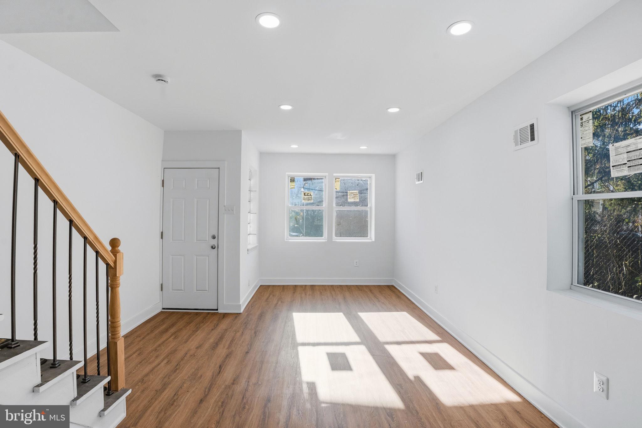 1281 Jackson Street Camden, NJ 08104 - Photo 7 of 43 a view of hallway with a window and wooden floor