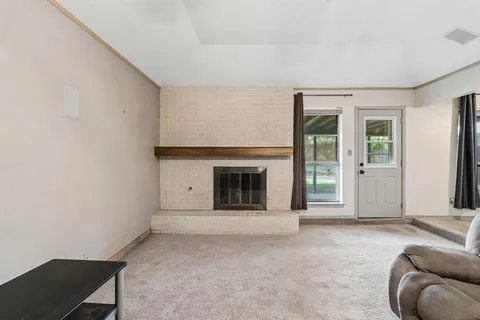 a view of a livingroom with a fireplace
